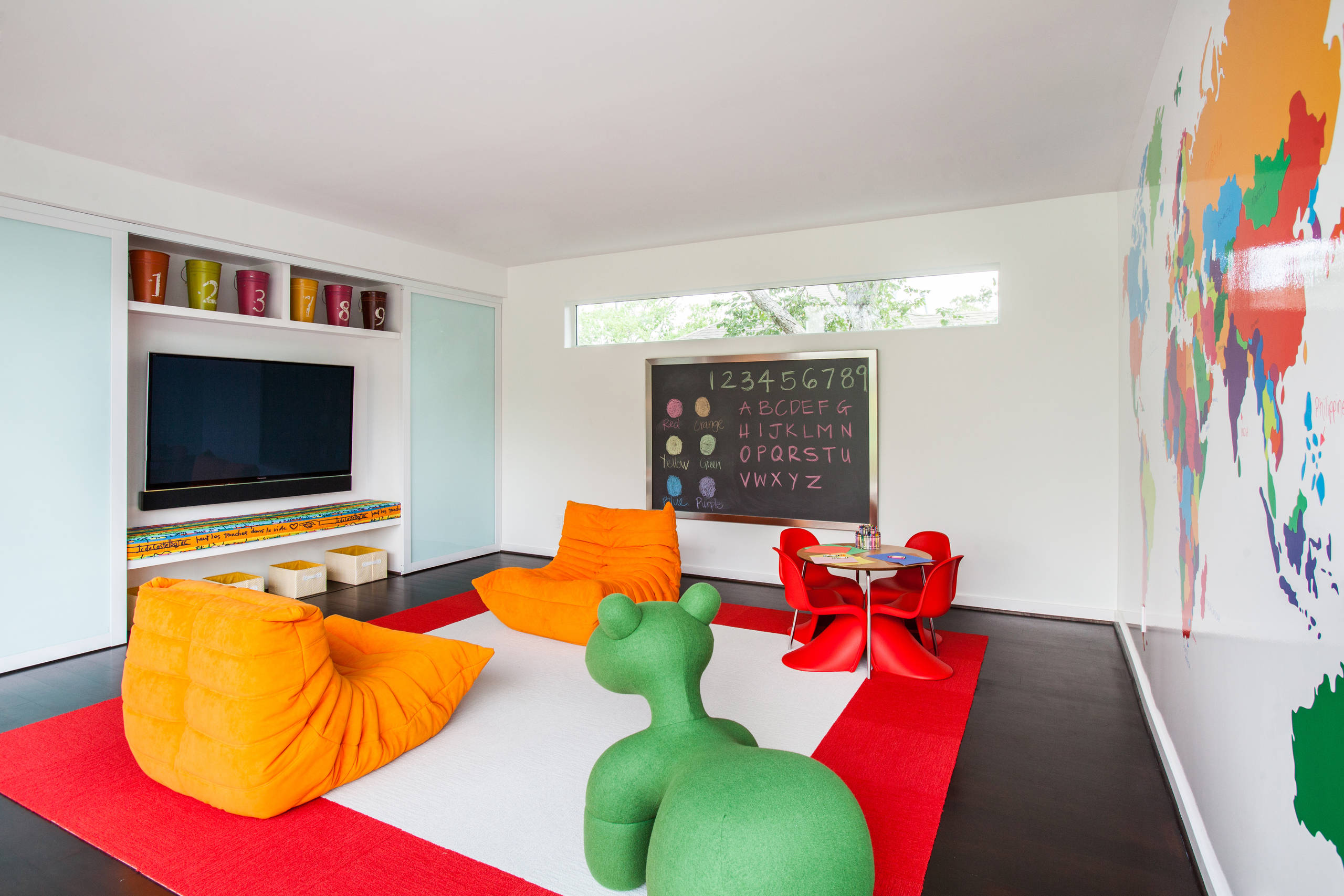 orange togo sofa and pony chair in a classroom